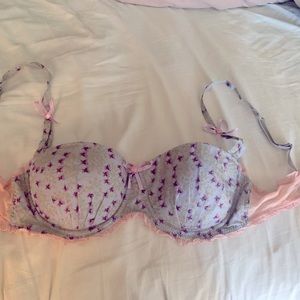 Frilly bra with bows and floral print. Made by Pinkerton sold by Anthropologie